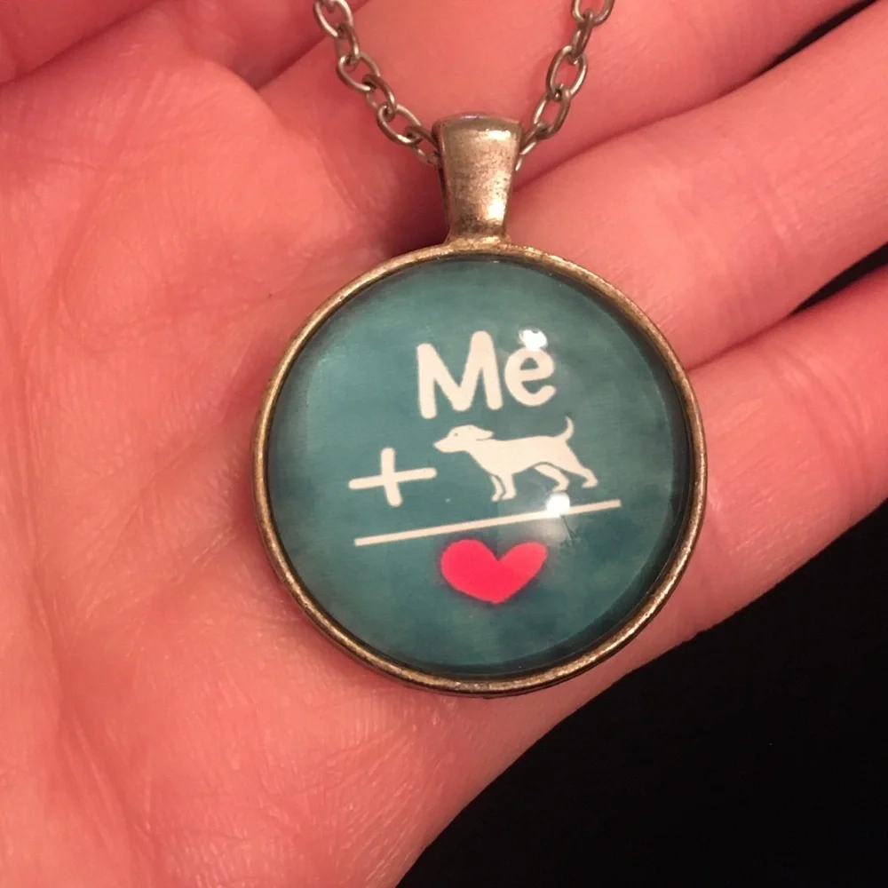Charming Teal Necklace with Heart and Dog Design